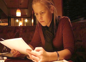 Photo of a playwright looking over a script.